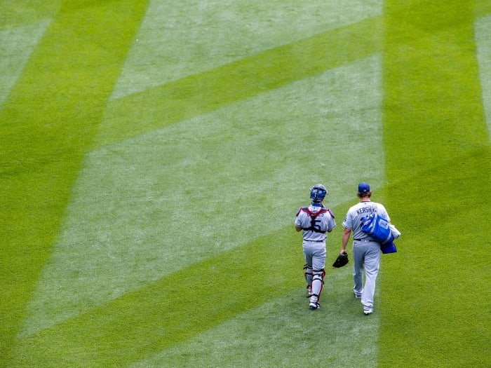Clayton Kershaw walking with a teammate